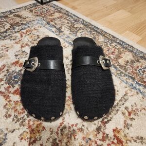 Black and silver clogs